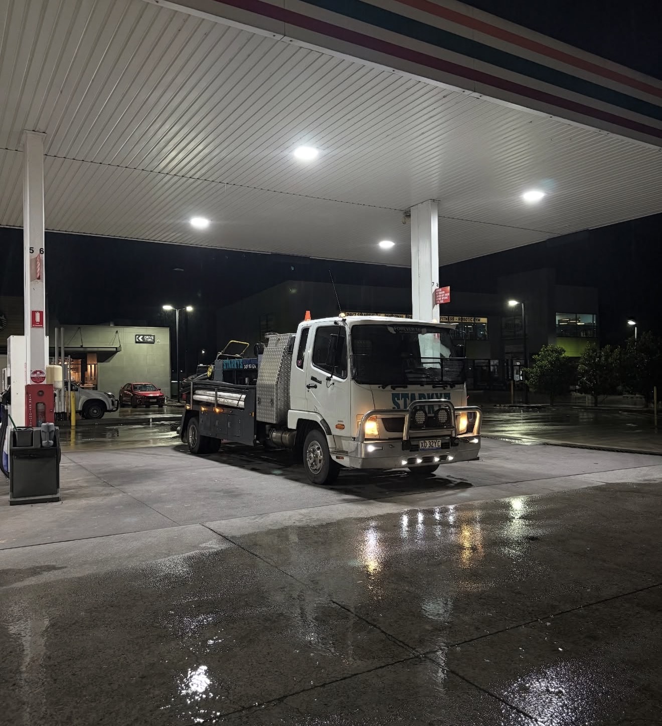 Starkys Concrete Pumping truck fuelling up at night