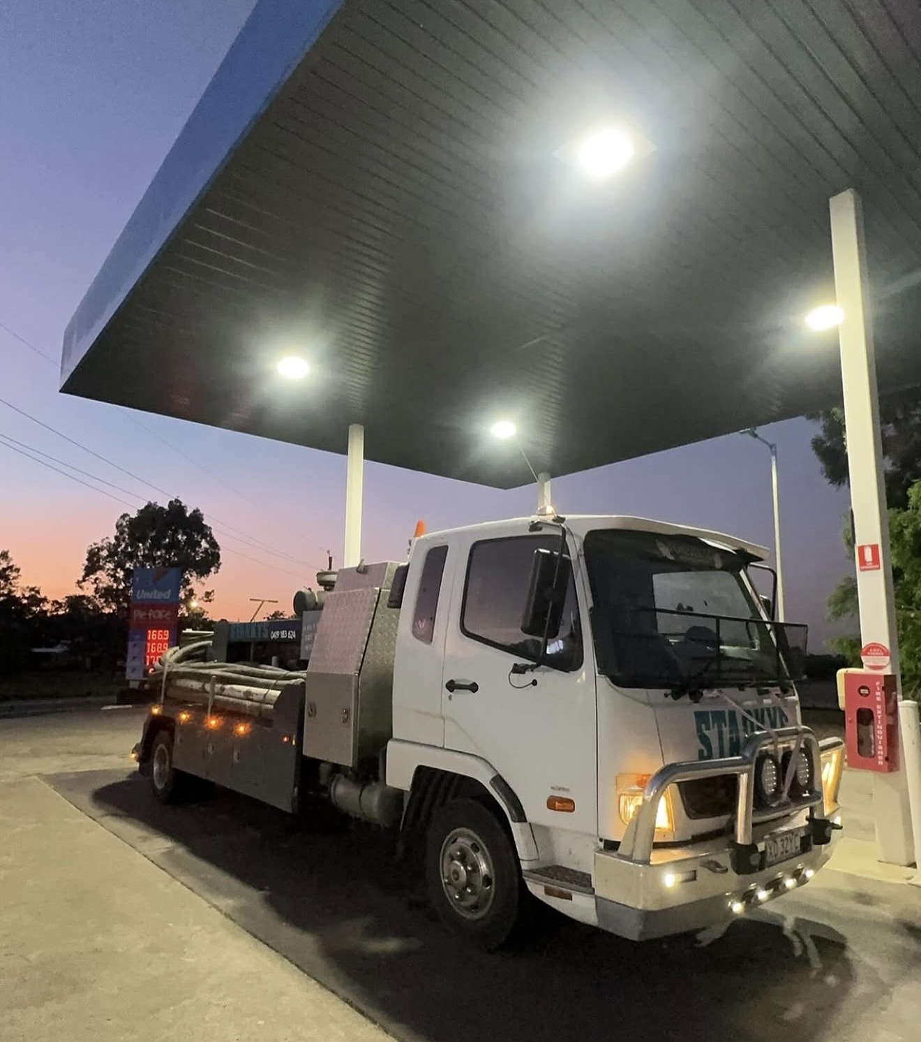 Starkys Concrete Pumping truck at dusk